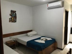 Ένα ή περισσότερα κρεβάτια σε δωμάτιο στο Pousada Mar Aberto