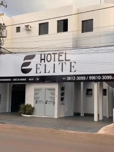 a hotel elite sign on the side of a building at Hotel Elite in Rio Verde