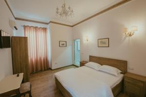 Krevet ili kreveti u jedinici u okviru objekta Hotel Loredano