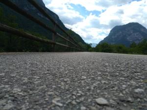 an empty road with mountains in the background at B&B Stella Al Pina in Tezze