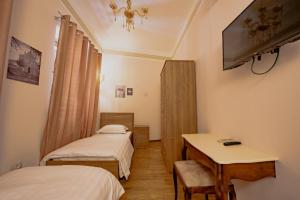 TV i/ili multimedijalni sistem u objektu Hotel Loredano