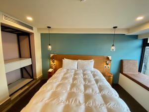 Säng eller sängar i ett rum på Hotel Clé Reforma Insurgentes