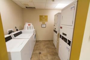 a laboratory with white appliances in a room at Candlewood Suites Santa Maria, an IHG Hotel in Santa Maria