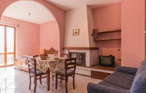 a living room with a table and a fireplace at Borgo Nuovo San Martino in Ambra