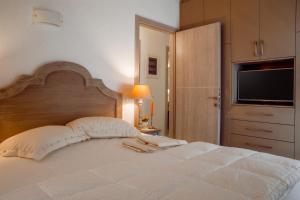 Postel nebo postele na pokoji v ubytování Eleni's Guesthouse