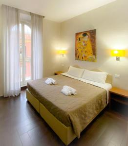 Postel nebo postele na pokoji v ubytování Rome Travellers Hotel