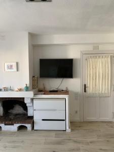 Televízia a/alebo spoločenská miestnosť v ubytovaní Apartamento in Cullera. Spain