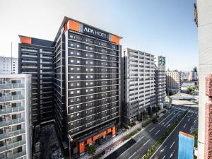 an aerial view of a building with a sign on it at APA Hotel Shin Osaka Ekimae in Osaka +37 photos
