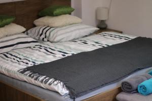 Postel nebo postele na pokoji v ubytování Apartmány Caffe & Grill