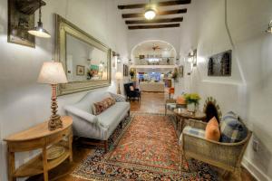 a living room with a couch and a table at Armory Park Inn in Tucson