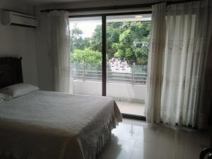 Giường trong phòng chung tại Hotel Misional