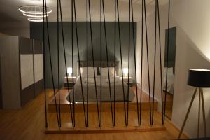 A bed or beds in a room at Cinema Zeus Studios - by Avelink
