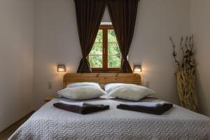 Posteľ alebo postele v izbe v ubytovaní Rustic Lodge Plitvice