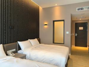 Postel nebo postele na pokoji v ubytování Champ De Rose Hotel + 16 fotografií