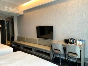 Postel nebo postele na pokoji v ubytování Champ De Rose Hotel