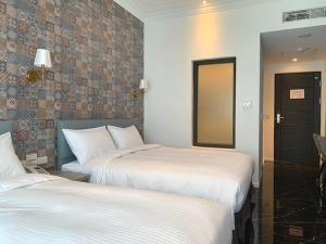 Postel nebo postele na pokoji v ubytování Champ De Rose Hotel