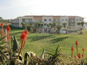 a view of a park with buildings in the background at The Surf Studio - Ericeira in Ericeira