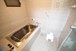Koupelna v ubytování Comodita GH