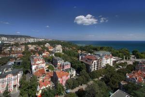 an aerial view of a city with buildings and the ocean at Hotel & Casino Cherno More in Varna City