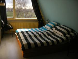 Postel nebo postele na pokoji v ubytování B&B-Edam