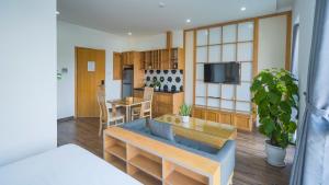 a living room with a couch and a table at Minh Hung Apartment & Hotel in Danang