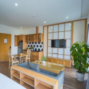 a living room with a couch and a table at Minh Hung Apartment & Hotel in Danang