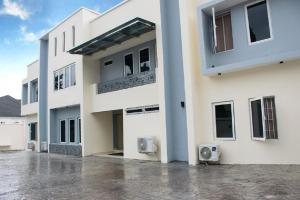 a large white building with a lot of windows at Lit Suites in Abuja