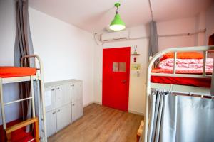 Postel nebo postele na pokoji v ubytování SUM Guesthouse Jeju Airport