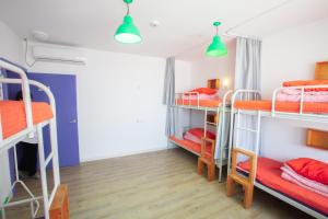 Postel nebo postele na pokoji v ubytování SUM Guesthouse Jeju Airport