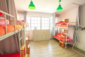 Postel nebo postele na pokoji v ubytování SUM Guesthouse Jeju Airport