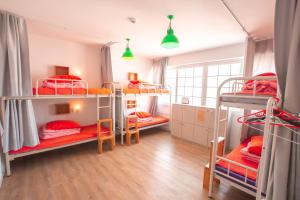 Postel nebo postele na pokoji v ubytování SUM Guesthouse Jeju Airport