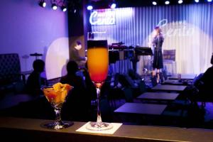 a drink sitting on a table in a restaurant at Piazza Hotel Nara in Nara