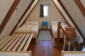 מיטה או מיטות בחדר ב-Intertranscoop Lake House