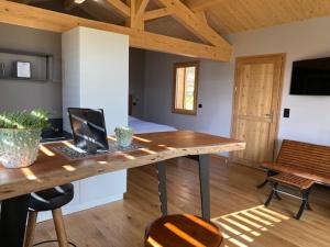 a room with a desk with a laptop on it at Les Barras’k in Saint-Péray