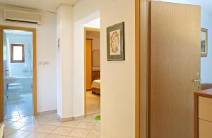 a hallway with a bathroom and a bedroom at Apartments Vinka in Jelsa +46 photos
