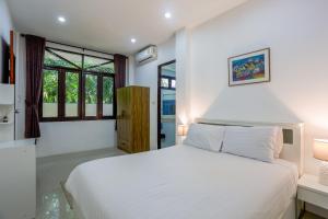 Vuode tai vuoteita majoituspaikassa Brodie Rawai Resort
