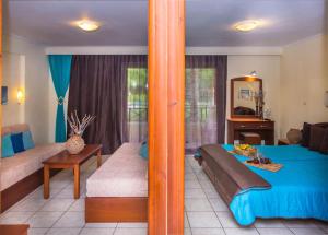 Postel nebo postele na pokoji v ubytování DAMIA HOTEL Apts