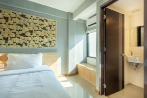 Postel nebo postele na pokoji v ubytování PLAAI Play Hotel