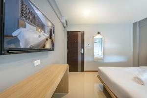 Postel nebo postele na pokoji v ubytování PLAAI Play Hotel