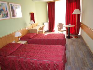 Postel nebo postele na pokoji v ubytování Hotel Zdravilisce - Thermana Lasko