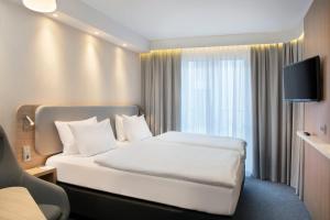 Postel nebo postele na pokoji v ubytování Holiday Inn Express Baden-Baden by IHG