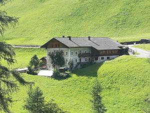 an aerial view of a large house on a hill at Ferienwohnung Innerlipper in Innervillgraten +5 photos