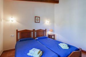 A bed or beds in a room at Agroturismo Can Patro