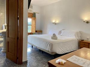 Cama o camas de una habitación en El Mesón de Despeñaperros
