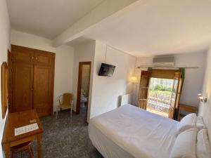 Cama o camas de una habitación en El Mesón de Despeñaperros