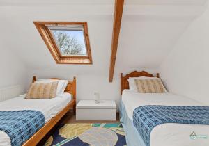 Postel nebo postele na pokoji v ubytování 1 Lambston Cottage