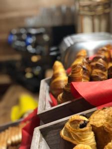 a bunch of pastries sitting on a table at Lautaret Lodge & Spa in Le Monêtier-les-Bains