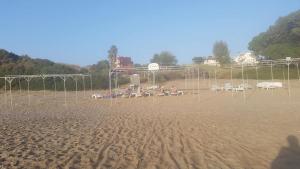 a soccer field with chairs and a goal at Hotel Schönberg in Kızılot