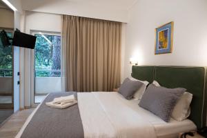 Postel nebo postele na pokoji v ubytování Anastazia Luxury Suites & Spa