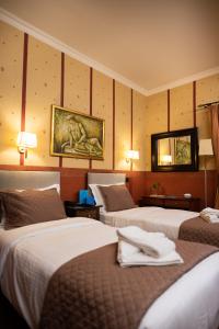 Postel nebo postele na pokoji v ubytování Anastazia Luxury Suites & Spa